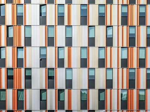 Building facade finished in colored cladding panels