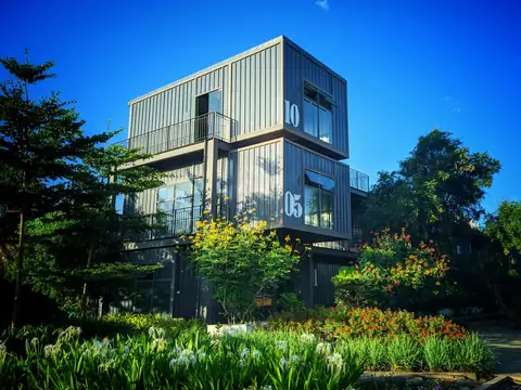 Modern building assembled from stacked prefabricated modules